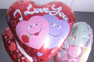 Metallic heart-shaped Valentine's Day balloons.